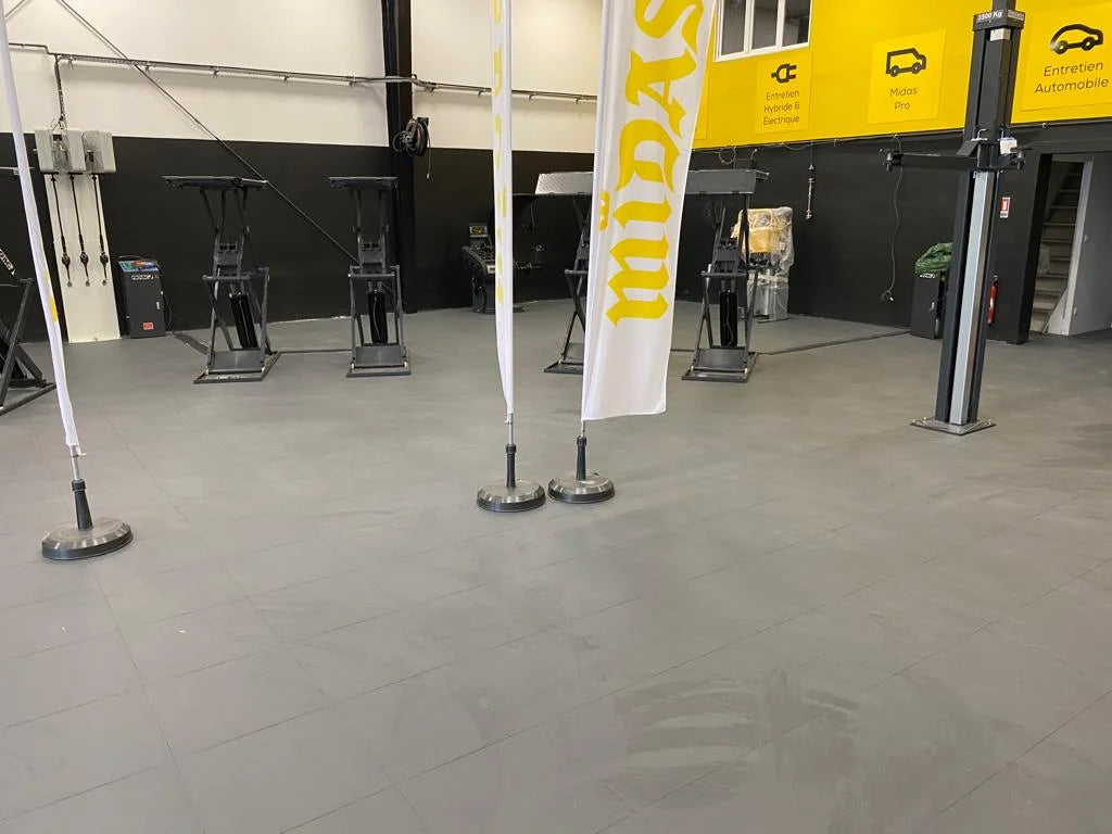 Brie Auto Services Workshop after installing 400 m² of dark gray PVC tiles using an adhesive