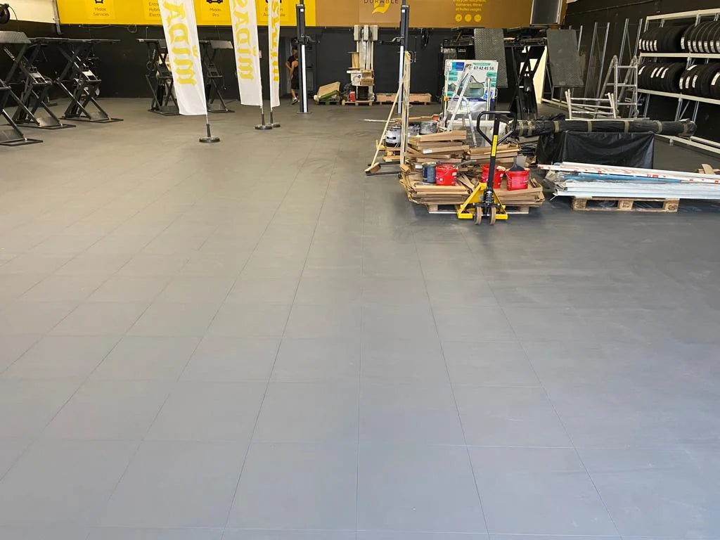 Overview of the Brie Auto Services workshop, with a floor of PVC tiles glued to sanded ceramic tile